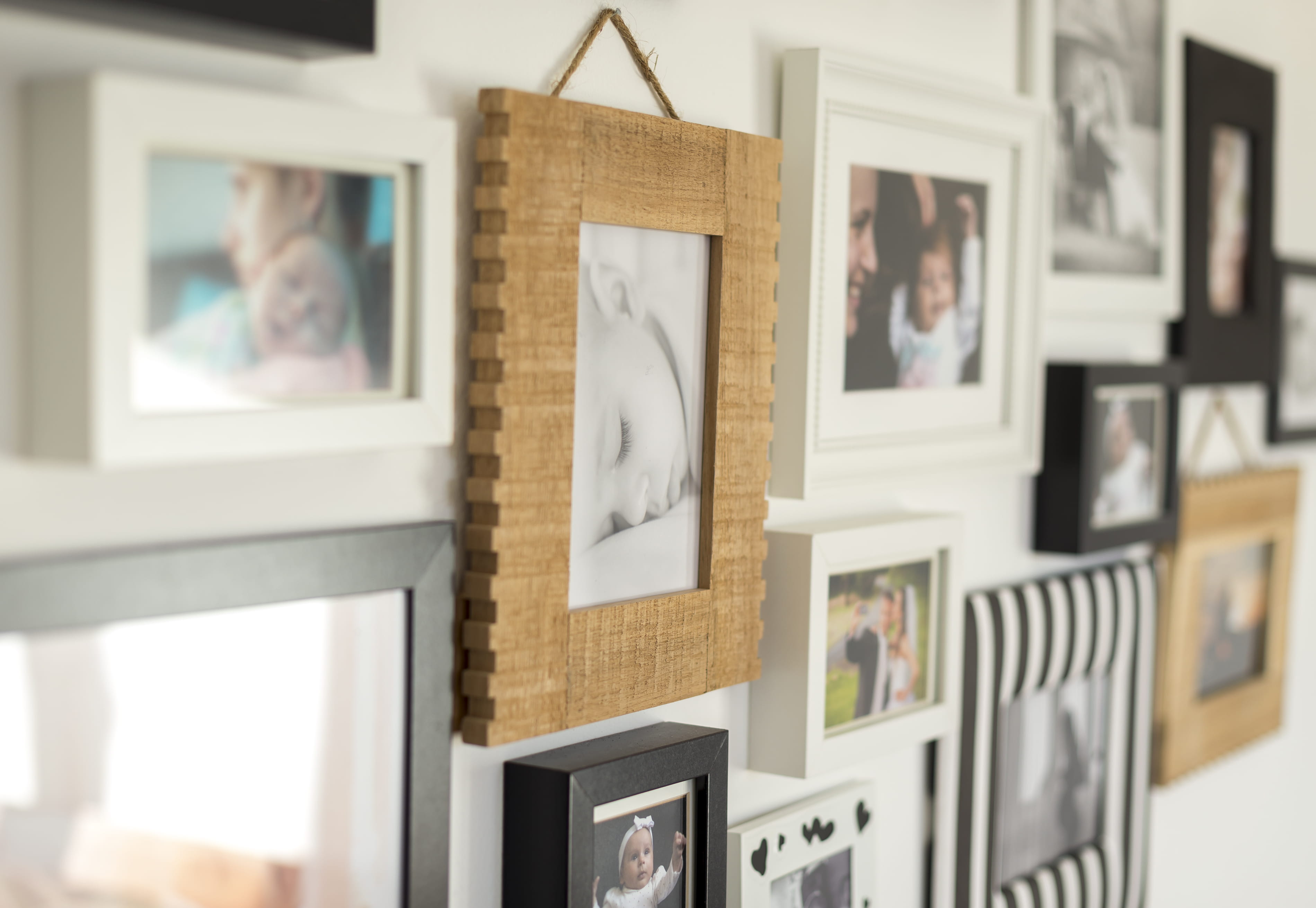 Picture in a variety of frames on a wall